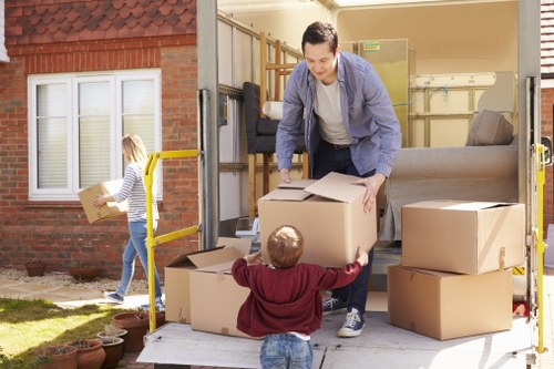 Customer moving storage items safely in a secure self storage facility